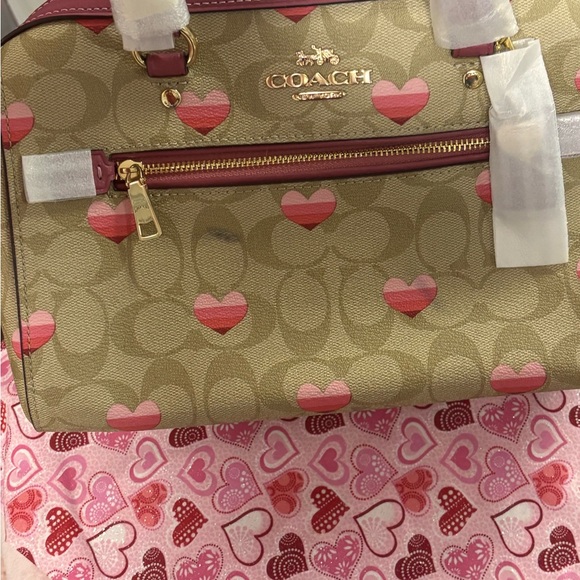 Coach Handbags - Coach Tan and Pink Heart Print Rowen Satchel and matching wallet
